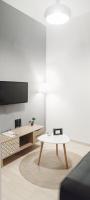 Televízia a/alebo spoločenská miestnosť v ubytovaní Eva apartment