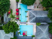 an overhead view of a swimming pool with trees at Anantara Rasananda Koh Phangan Villas in Thong Nai Pan Noi