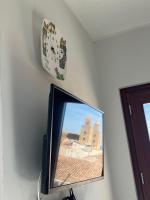 Televízia a/alebo spoločenská miestnosť v ubytovaní Amori di Sicilia