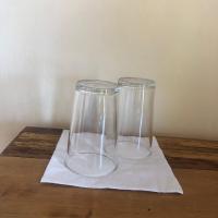 two glass vases sitting on top of a napkin at Soanala in Moramanga