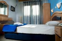 Posteľ alebo postele v izbe v ubytovaní Hôtel Argo