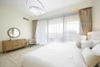 Postel nebo postele na pokoji v ubytování NewArabian Dubai Hills Sidra Villa