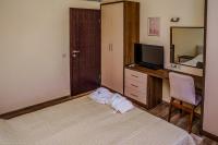 TV a/nebo společenská místnost v ubytování Апартамент Пирин Apartment Pirin