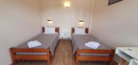Posteľ alebo postele v izbe v ubytovaní Paleo Inn Hotel