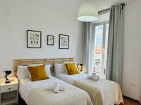 A bed or beds in a room at Apartamentos Alcazaba