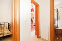 A bed or beds in a room at Helios Villa Sea Front - 3 bedrooms 7 guests