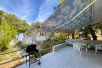 A garden outside Helios Villa Sea Front - 3 bedrooms 7 guests