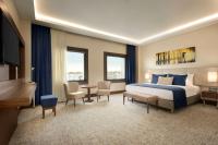 A bed or beds in a room at Ramada by Wyndham Yalova