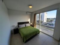 departamento en Nordelta condo 216 2 amb bahia de Nordeltaにあるベッド