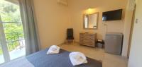 Posteľ alebo postele v izbe v ubytovaní Paleo Inn Hotel