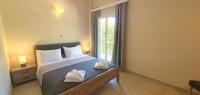 Posteľ alebo postele v izbe v ubytovaní Paleo Inn Hotel