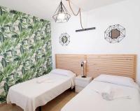 Postel nebo postele na pokoji v ubytování Vivienda Vacacional Hábitat Tropical