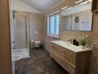Kúpeľňa v ubytovaní Apartments Brajde