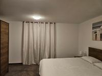Posteľ alebo postele v izbe v ubytovaní Apartments Brajde