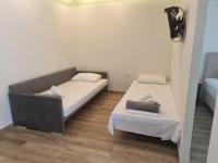 Postel nebo postele na pokoji v ubytování Coral Boutique Apartments