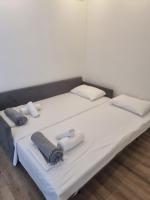 Postel nebo postele na pokoji v ubytování Coral Boutique Apartments