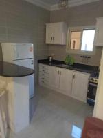 Kuchyň nebo kuchyňský kout v ubytování Stylish apartment-Ard El Gameia