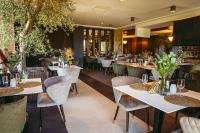 En restaurant eller et andet spisested på Alpine Escape Studio - Silver Mountain Resort & SPA - Poiana Brasov