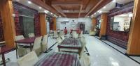 a restaurant with tables and chairs in a room at SIESTA HOTEL in Djibouti