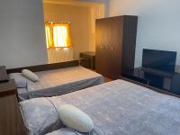 Postel nebo postele na pokoji v ubytování Alpin Guest House