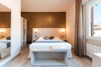 a bedroom with two beds and a window at Hotel Stella Del Mare in Chiavari