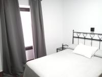 Posteľ alebo postele v izbe v ubytovaní Hostal Cuzco