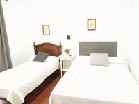 Posteľ alebo postele v izbe v ubytovaní Hostal Cuzco