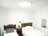 Posteľ alebo postele v izbe v ubytovaní Hostal Cuzco