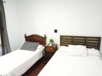 Posteľ alebo postele v izbe v ubytovaní Hostal Cuzco