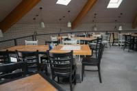 a dining room with wooden tables and chairs at Resort Špindl in Špindlerův Mlýn