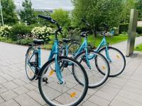 three bikes parked next to each other on a sidewalk at Motel One Salzburg-Mirabell in Salzburg