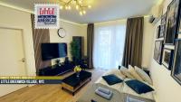 Televízia a/alebo spoločenská miestnosť v ubytovaní Little Americas Ring Apartments
