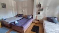 Postel nebo postele na pokoji v ubytování Aura house