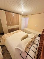 Casa para temporadaにあるベッド