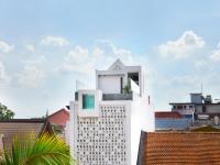 a white building with a window on top of it at Aborest Tropical Hostel in Siem Reap