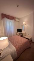 Łóżko lub łóżka w pokoju w obiekcie Hotel Terranova