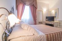 Łóżko lub łóżka w pokoju w obiekcie Hotel Terranova