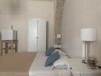 A bed or beds in a room at Affittacamere La Torre