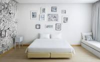 a white bedroom with a bed and a couch at Beat Hotel Bangkok in Bangkok