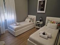 Posteľ alebo postele v izbe v ubytovaní Home K&Y - Aurelio