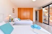 A bed or beds in a room at Villa Gran Canaria Specialodges