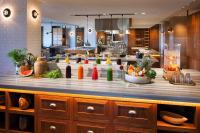 a kitchen with a counter with many different bottles on it at Andaz Maui at Wailea Resort - A Concept by Hyatt in Wailea