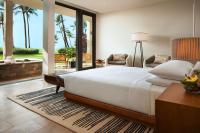 a bedroom with a large white bed and a patio at Andaz Maui at Wailea Resort - A Concept by Hyatt in Wailea