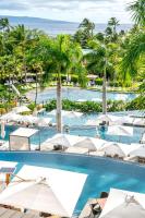 an image of a pool with umbrellas and palm trees at Andaz Maui at Wailea Resort - A Concept by Hyatt in Wailea