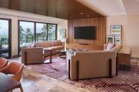 a living room with couches and a flat screen tv at Andaz Maui at Wailea Resort - A Concept by Hyatt in Wailea