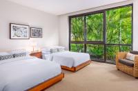 a bedroom with two beds and a large window at Andaz Maui at Wailea Resort - A Concept by Hyatt in Wailea