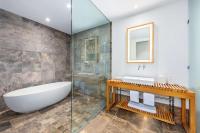 a bathroom with a tub and a sink and a shower at Andaz Maui at Wailea Resort - A Concept by Hyatt in Wailea