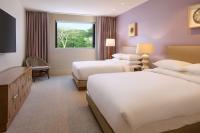 a hotel room with two beds and a window at Andaz Maui at Wailea Resort - A Concept by Hyatt in Wailea