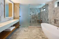 a bathroom with a tub and a shower at Andaz Maui at Wailea Resort - A Concept by Hyatt in Wailea