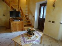 A television and/or entertainment centre at Casevacanza Val d'Ayas